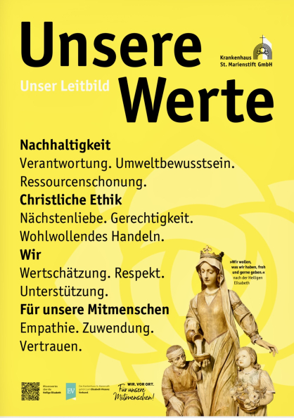 Das Leitbild trägt die Überschrift „Unsere Werte“ und ist auf einem gelben Hintergrund gedruckt. Rechts unten im Bild ist ein Foto der Heiligen Elisabeth zu sehen. Außerdem sind viele christliche Werte als Schlagworte zu erkennen.